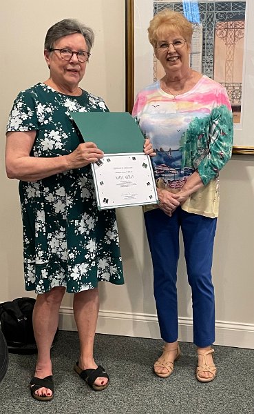 Sandy Cooper honoring Sally Arman for 20 years as a volunteer
